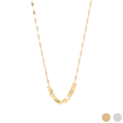 Gold necklace with geometric beads on a white background