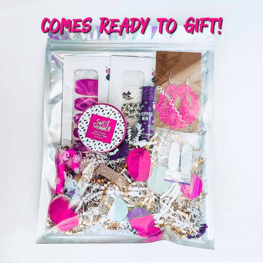 Mani bundle packed in a shimmery gift bag with crinkle paper and confetti